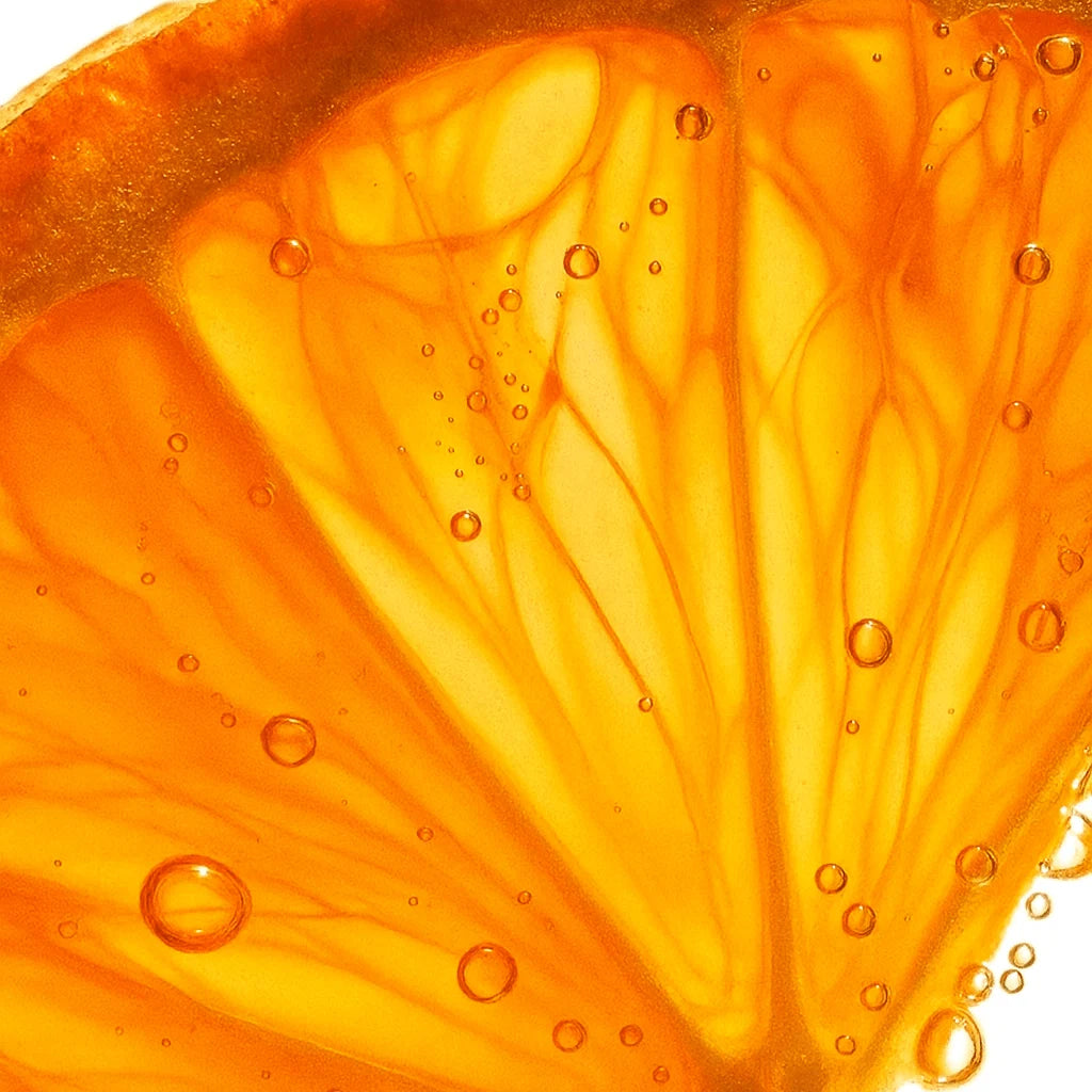 Bright orange citrus slices dusted with vitamin C powder